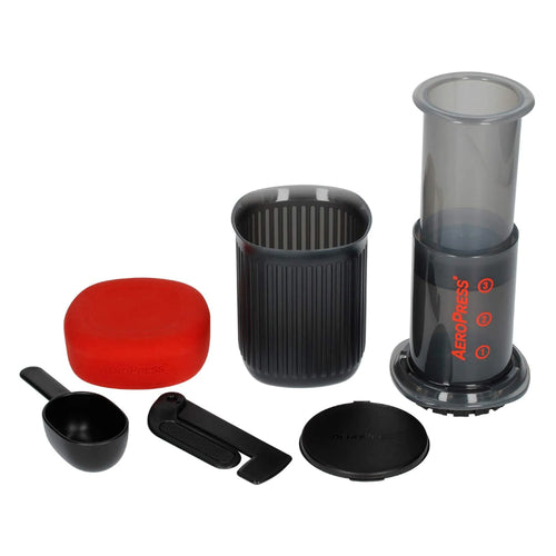 AeroPress Go portable coffee maker set with brewing chamber, scoop, stirrer, and carrying case