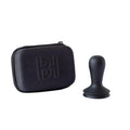 Barista Hustle Tamper with ergonomic black handle and protective carrying case for coffee accessories