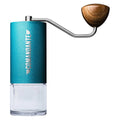 Comandante C40 MK4 coffee grinder hand grinder in blue with wooden handle and clear container
