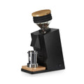 Eureka Mignon Oro Single Dose black coffee grinder with wooden accents and bean hopper