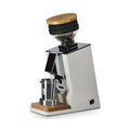 Eureka Mignon Oro Single Dose coffee grinder with wooden lid and metal dosing cup on wooden base