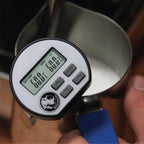 Rhino Digital Thermometer attached to a milk frothing pitcher showing temperature readings