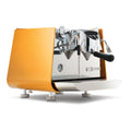 Victoria Arduino E1 Prima EXP Pure Brew espresso machine in yellow with chrome details and steam wand