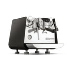 Victoria Arduino E1 Prima espresso machine with sleek black and chrome finish and professional brewing tools